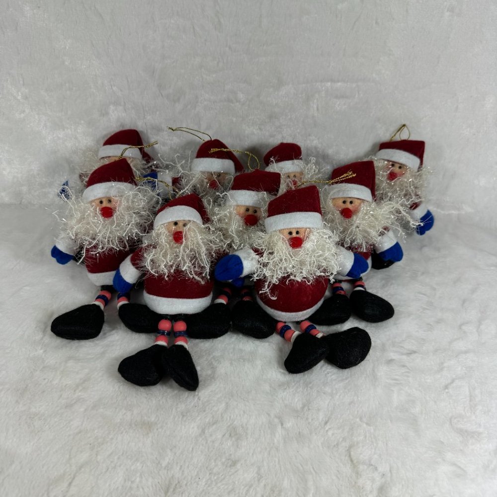Set of 9 stuffed Santa Claus Christmas ornaments & string of Hats